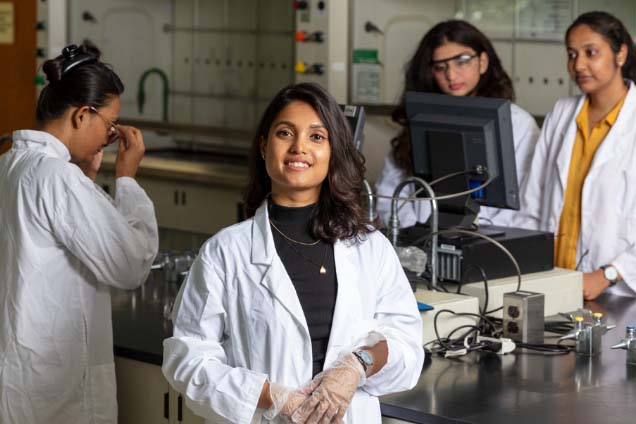Group of female students working in lab